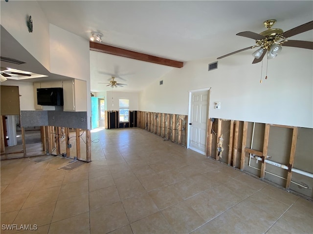 tiled empty room with vaulted ceiling with beams and ceiling fan