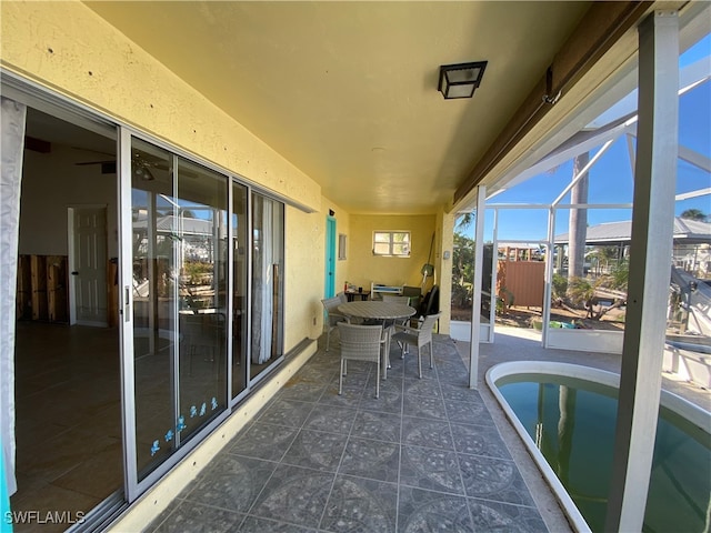 unfurnished sunroom with a pool