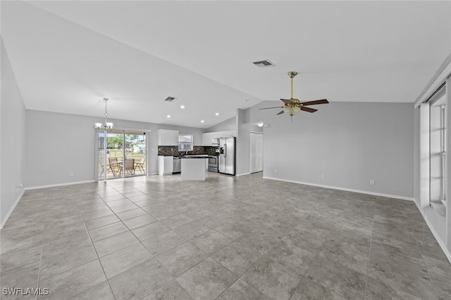 unfurnished living room with ceiling fan with notable chandelier, lofted ceiling, and light tile patterned flooring