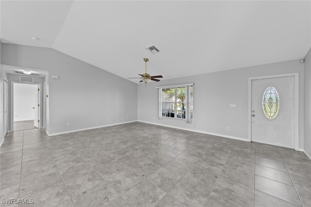 unfurnished living room with ceiling fan, light tile patterned floors, and lofted ceiling