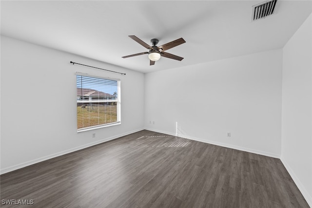 spare room featuring ceiling fan and dark hardwood / wood-style flooring