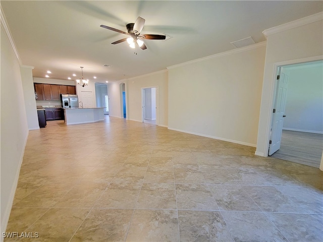 unfurnished living room with ceiling fan with notable chandelier and crown molding