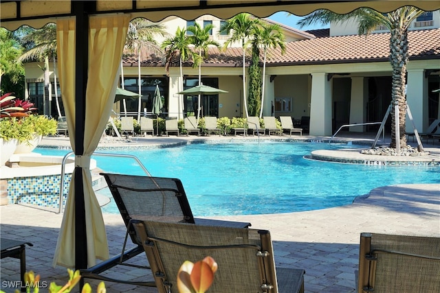 view of swimming pool with a patio