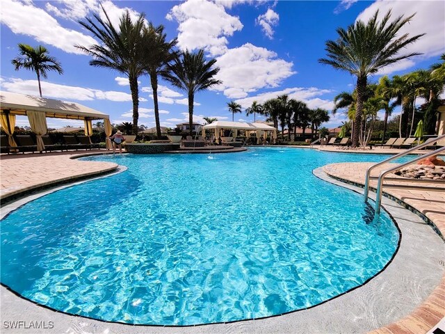 view of swimming pool featuring a patio and a gazebo