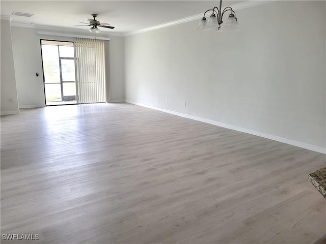 empty room featuring ceiling fan with notable chandelier, ornamental molding, and light wood-type flooring