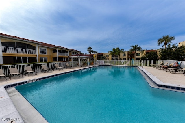 view of swimming pool with a patio