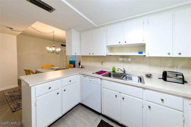 kitchen with a peninsula, a sink, white cabinets, hanging light fixtures, and dishwasher