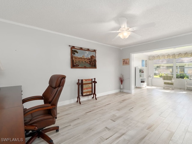 home office featuring ceiling fan, crown molding, a textured ceiling, and light wood-type flooring