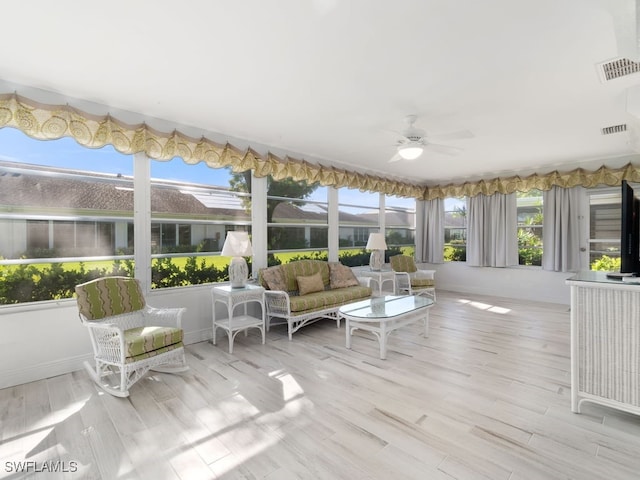 sunroom / solarium with ceiling fan