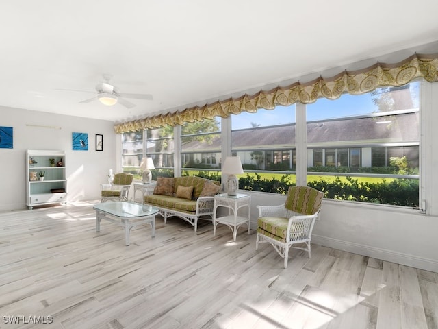 sunroom featuring a wealth of natural light and ceiling fan