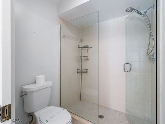 bathroom with toilet and walk in shower