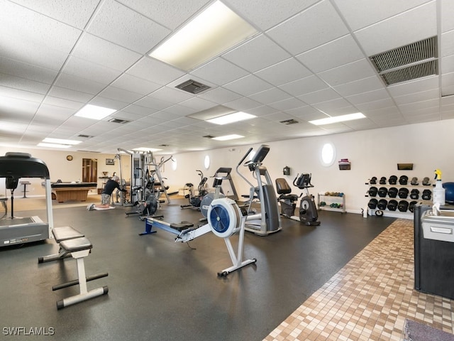 gym featuring a drop ceiling