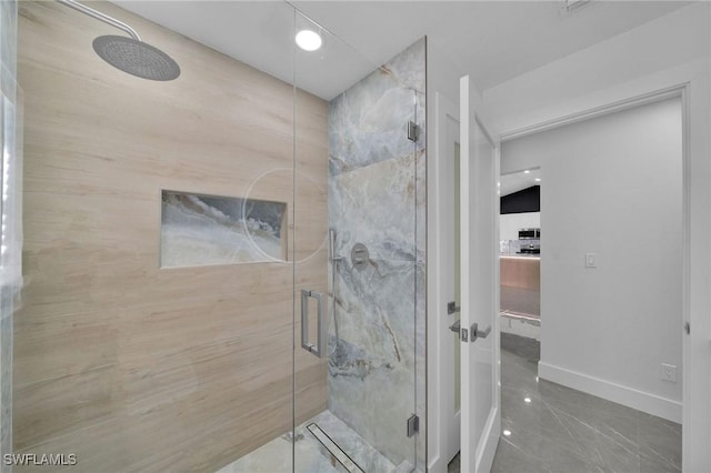 bathroom with a shower with shower door