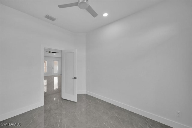 spare room featuring ceiling fan