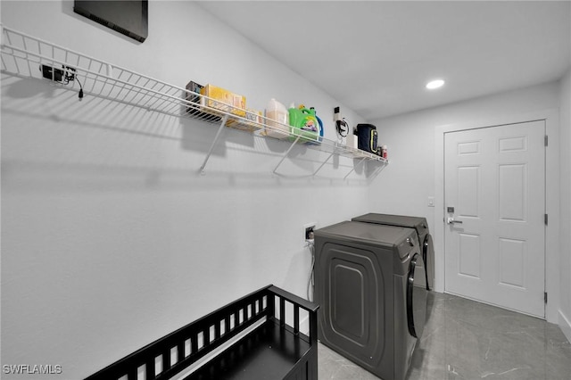 laundry room with washing machine and clothes dryer