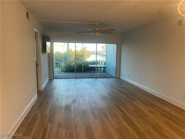 2876 Oleander St Unit D3, Saint James City, FL 33956 - spare room featuring a ceiling fan and wood finished floors