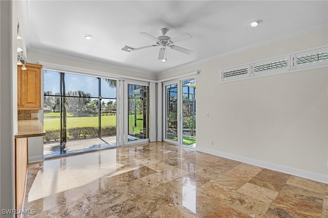 spare room with ceiling fan and ornamental molding