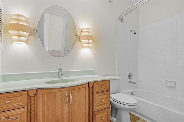 bathroom with shower / bathtub combination, toilet, and vanity