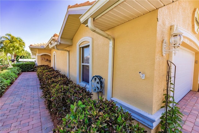 view of property exterior featuring a garage