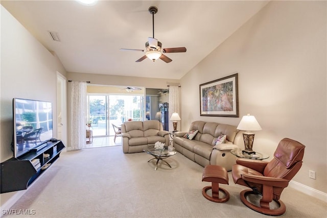 living room featuring lofted ceiling, ceiling fan, and carpet flooring