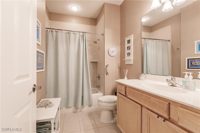 full bathroom with shower / tub combo with curtain, tile patterned floors, toilet, and vanity