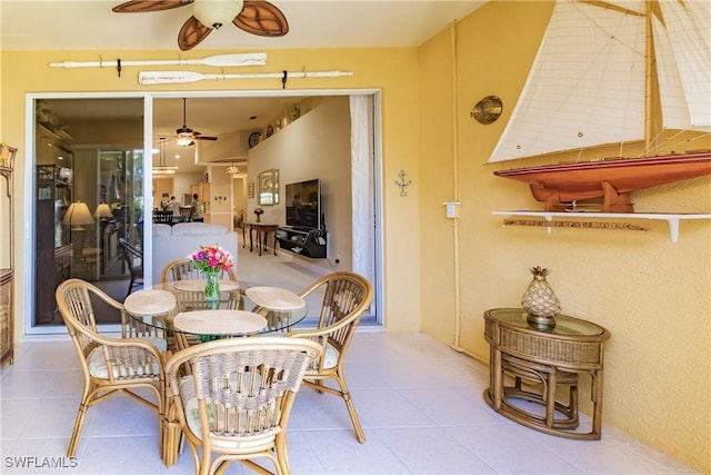 dining area featuring light tile patterned flooring and ceiling fan