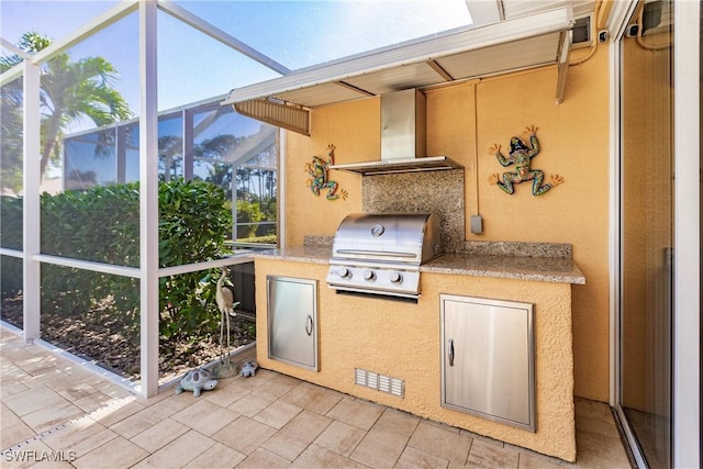 view of patio featuring a grill and exterior kitchen