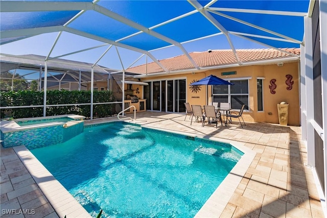 view of swimming pool with an in ground hot tub, a lanai, and a patio