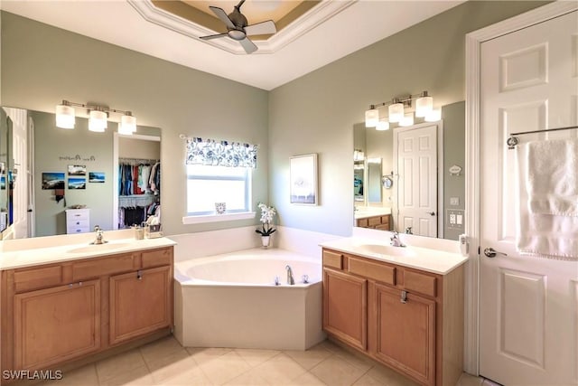 15192 Riverbend Blvd, North Fort Myers, FL 33917 - full bath with ceiling fan, two vanities, a bath, and tile patterned flooring