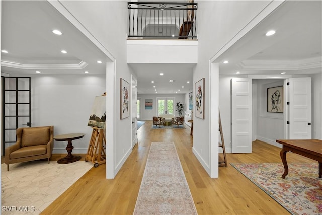 55 E Burning Tree Dr, Naples, FL 34105 - foyer entrance featuring recessed lighting, wood finished floors, a tray ceiling, and baseboards