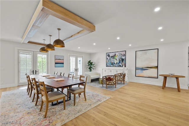 dining space featuring light hardwood / wood-style flooring and french doors