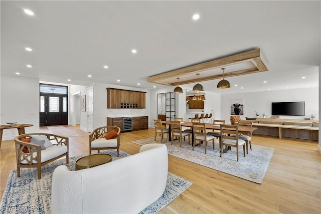 55 E Burning Tree Dr, Naples, FL 34105 - living room featuring wine cooler, light wood-style floors, and recessed lighting