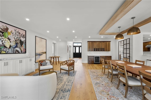 living room with wine cooler and light wood-type flooring