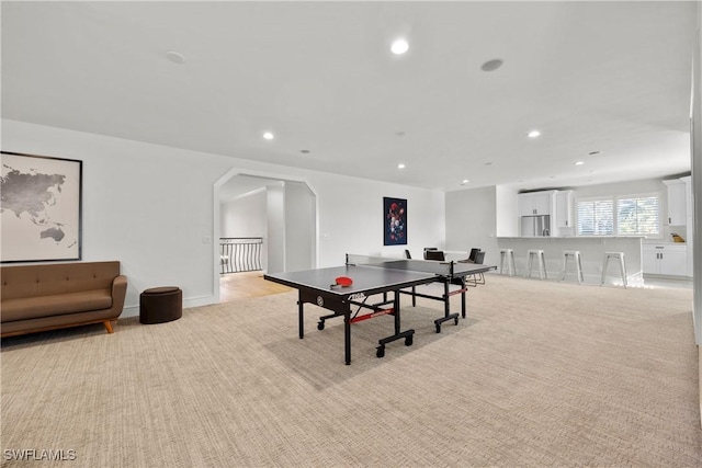 55 E Burning Tree Dr, Naples, FL 34105 - recreation room with recessed lighting, light carpet, and arched walkways