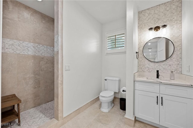 55 E Burning Tree Dr, Naples, FL 34105 - full bathroom with a walk in shower, vanity, toilet, baseboards, and tile patterned floors