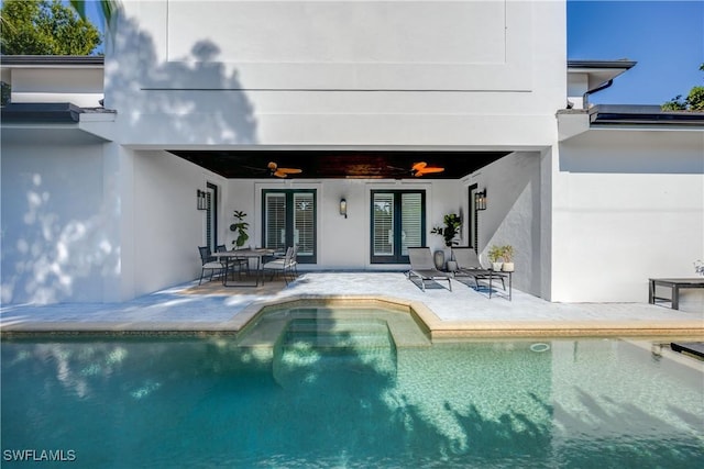 55 E Burning Tree Dr, Naples, FL 34105 - rear view of house featuring french doors, ceiling fan, a patio area, and stucco siding