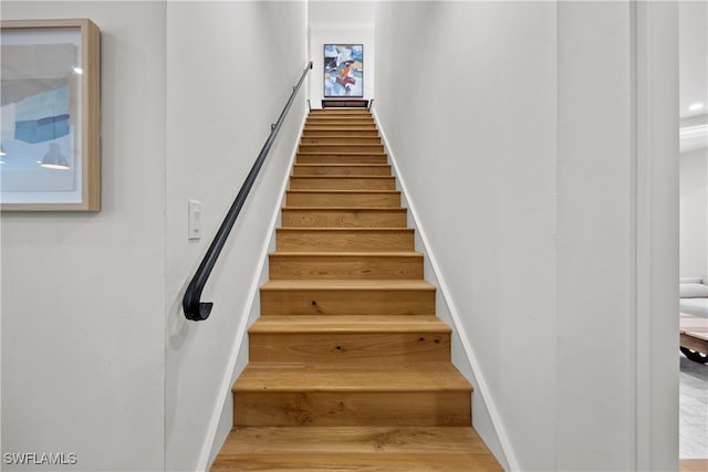 stairs with wood-type flooring