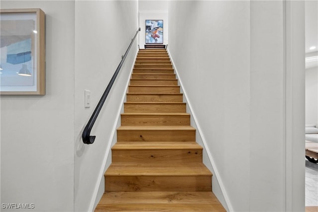 55 E Burning Tree Dr, Naples, FL 34105 - stairway featuring baseboards and wood finished floors