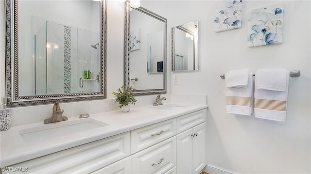 bathroom with vanity and a shower with shower door