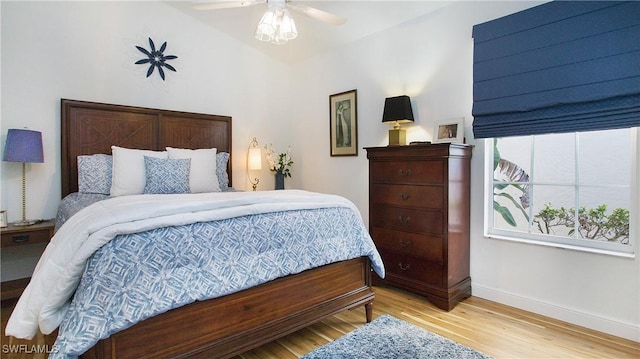 bedroom featuring light wood-type flooring and ceiling fan