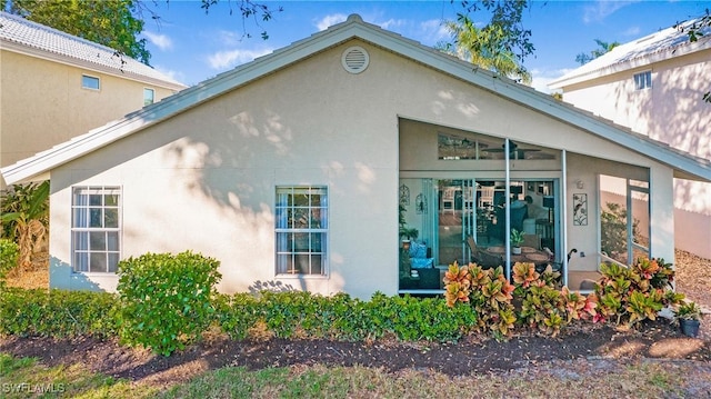 back of house with a sunroom