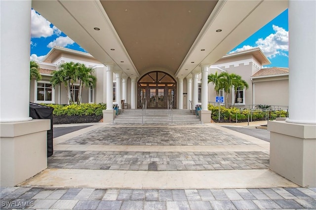 doorway to property with french doors and stucco siding