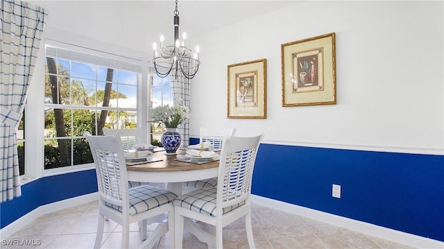 tiled dining area with a notable chandelier