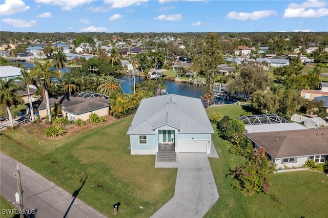 birds eye view of property featuring a water view