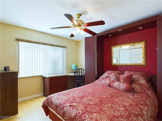 bedroom featuring ceiling fan and light hardwood / wood-style floors