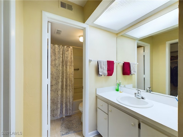 full bathroom featuring tile patterned floors, vanity, toilet, and shower / bathtub combination with curtain