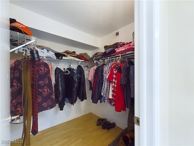 walk in closet featuring hardwood / wood-style flooring