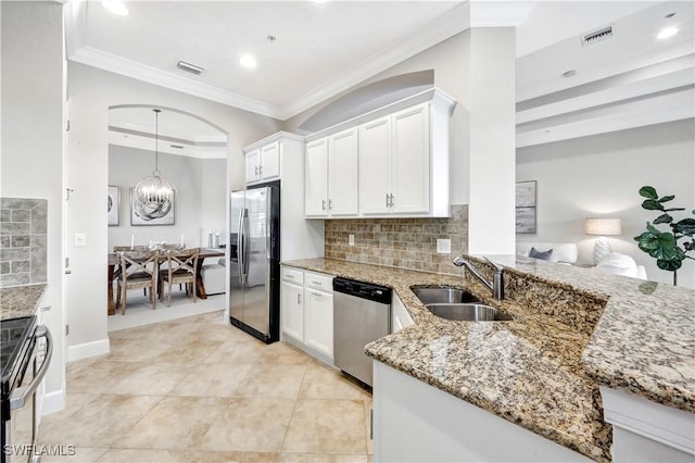 kitchen featuring white cabinetry, sink, ornamental molding, and stainless steel appliances