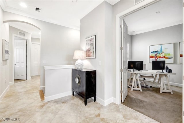 hall with crown molding and light tile patterned flooring