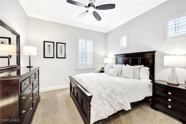 bedroom featuring light carpet, multiple windows, ornamental molding, and ceiling fan